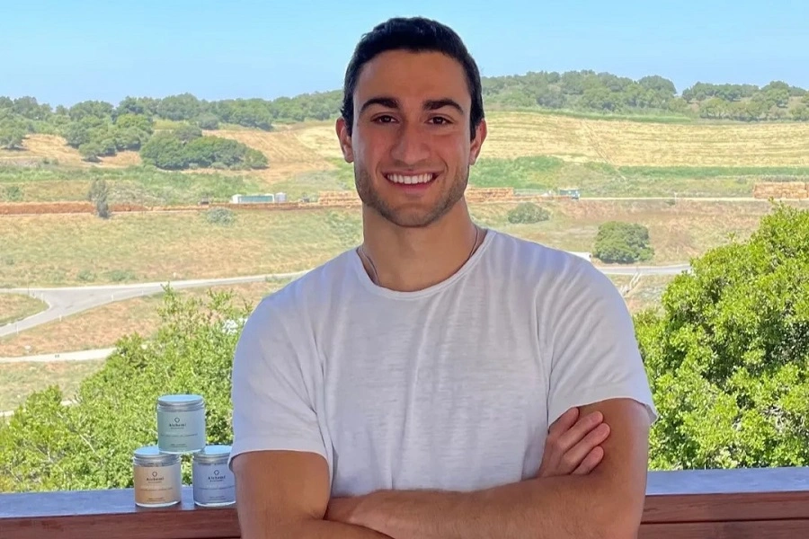 young man in white shirt with crossed arms